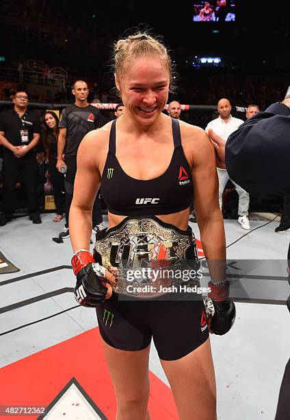Ronda Rousey of the United States celebrates her knock out victory over Bethe Correia of Brazil in the first round in their UFC women's bantamweight...