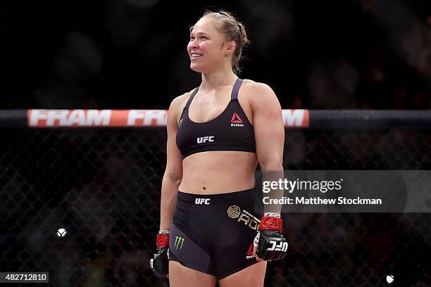 Ronda Rousey of the United States defeats Bethe Correia of Brazil in their bantamweight title fight during the UFC 190 Rousey v Correia at HSBC Arena...