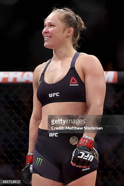 Ronda Rousey of the United States defeats Bethe Correia of Brazil in their bantamweight title fight during the UFC 190 Rousey v Correia at HSBC Arena...
