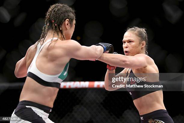 Ronda Rousey of the United States fights Bethe Correia of Brazi l in their bantamweight title fight during the UFC 190 Rousey v Correia at HSBC Arena...