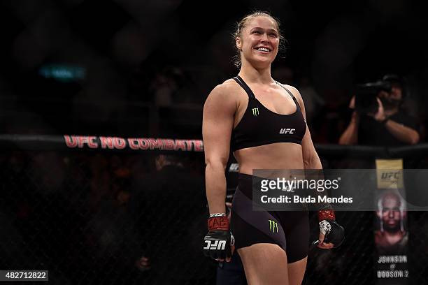 Ronda Rousey of the United States celebrates victory over Bethe Correia of Brazil in their bantamweight title fight during the UFC 190 Rousey v...