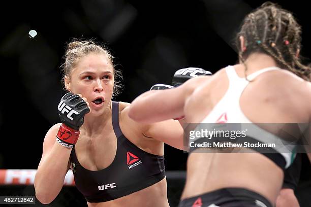 Ronda Rousey of the United States fights Bethe Correia of Brazi l in their bantamweight title fight during the UFC 190 Rousey v Correia at HSBC Arena...
