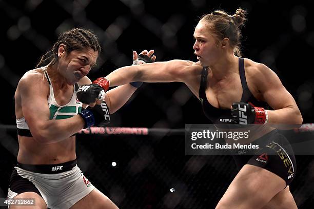 Ronda Rousey of the United States punches Bethe Correia of Brazil in their bantamweight title fight during the UFC 190 Rousey v Correia at HSBC Arena...