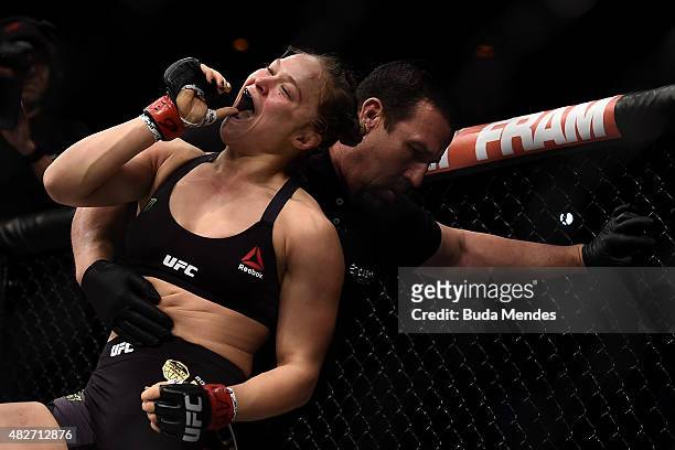 Ronda Rousey of the United States celebrates victory over Bethe Correia of Brazil in their bantamweight title fight during the UFC 190 Rousey v...