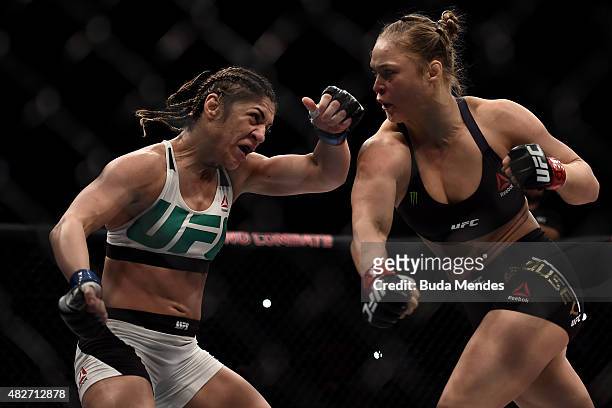 Ronda Rousey of the United States punches Bethe Correia of Brazil in their bantamweight title fight during the UFC 190 Rousey v Correia at HSBC Arena...
