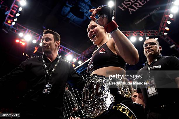 Ronda Rousey of the United States celebrates victory over Bethe Correia of Brazil in their bantamweight title fight during the UFC 190 Rousey v...