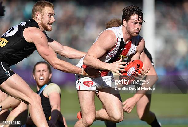 Jack Steven of the Saints breaks clear from Andrew Moore of the Power during the round 18 AFL match between the Port Adelaide Power and the St Kilda...