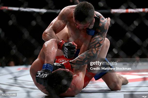 Dileno Lopes of Brazil fights Reginaldo Vieira of Brazil in their bantamweight bout during the UFC 190 Rousey v Correia at HSBC Arena on August 1,...