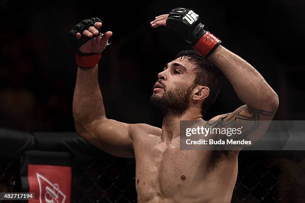 Glaico Franca of Brazil celebrates his submission victory over Fernando Bruno of Brazil in their lightweight bout during the UFC 190 Rousey v Correia...