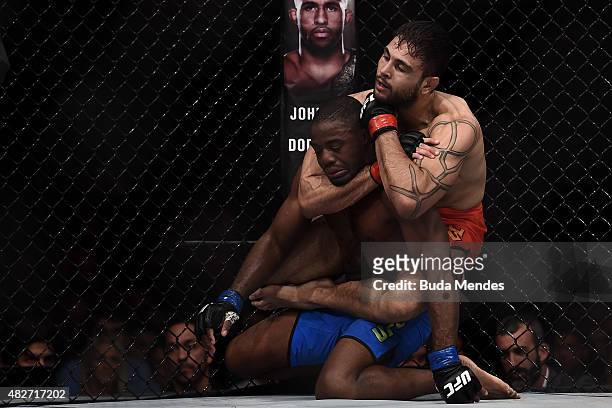 Glaico Franca of Brazil submits Fernando Bruno of Brazil in their lightweight bout during the UFC 190 Rousey v Correia at HSBC Arena on August 1,...
