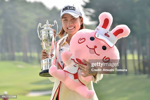 Erina Hara of Japan poses with the trophy after winning the Daito Kentaku Eheyanet Ladies 2015 at the Narusawa Golf Club on August 2, 2015 in...