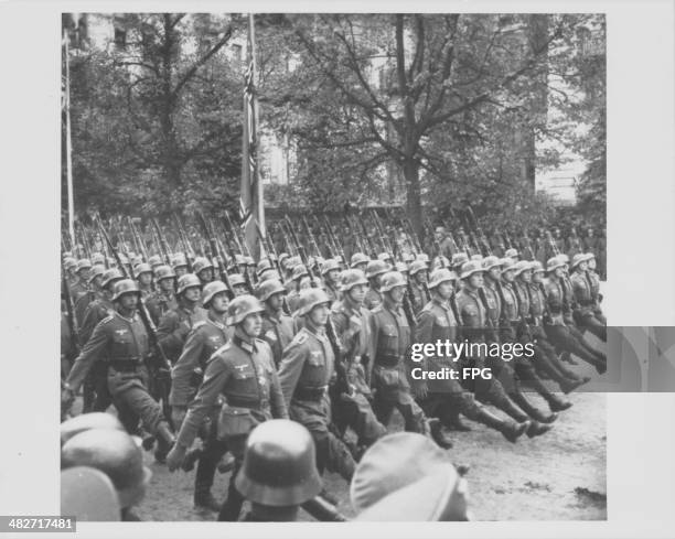 German troops marching through occupied Warsaw during World War Two, Poland, circa 1939.