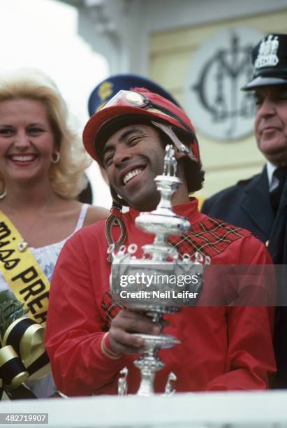 Preakness Stakes: Closeup of jockey Angel Cordero Jr. Victorious with Woodlawn Vase trophy after winning race aboard Codex at Pimlico Race Course....