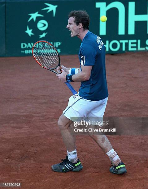 Andy Murray of Great Britain celebrates saving second set point against him whilst playing the second rubber against Andreas Seppi of Italy during...