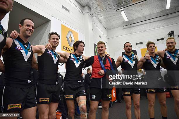 Port Adelaide players sing club song after victory in the round 18 AFL match between the Port Adelaide Power and the St Kilda Saints at Adelaide Oval...