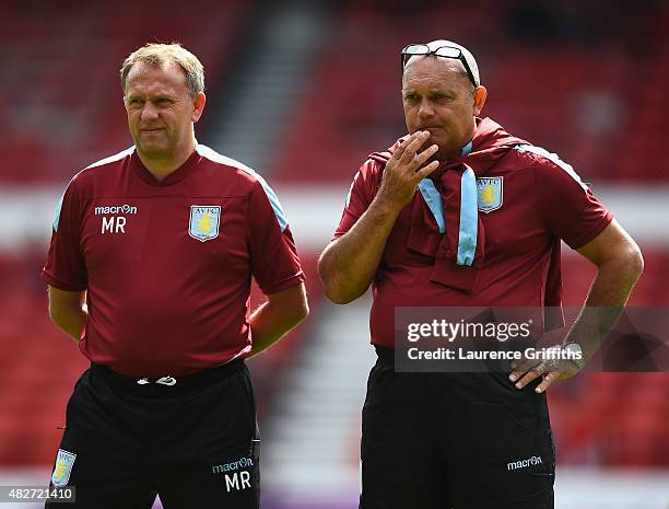 Mark Robson and Ray Wilkins of Aston Villa look on prior to the Pre Season Friendly match between Nottingham Forest and Aston Villa at City Ground on...