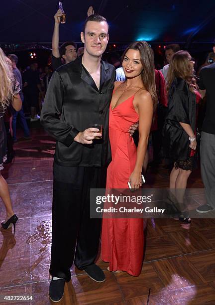 Cooper Hefner and actress Scarlett Byrne attend the annual Midsummer Night's Dream Party at the Playboy Mansion hosted by Hugh Hefner on August 1,...