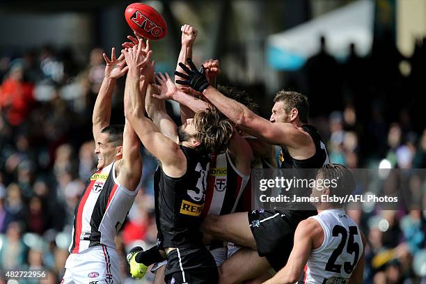 Shane Savage of the Saints flies with Justin Westhoff and Jay Schulz of the Power during the 2015 AFL round 18 match between Port Adelaide Power and...