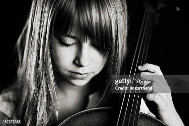 beautiful little cellist - girl cello stock pictures, royalty-free photos & images