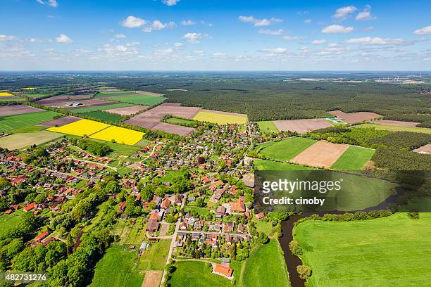 aerial view of suburban area and agricultural land in germany - lower saxony stock pictures, royalty-free photos & images