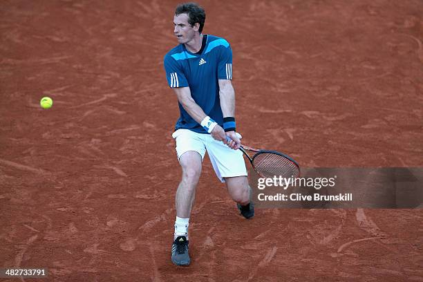 Andy Murray of Great Britain slides to play a backhand against Andreas Seppi of Italy during day one of the Davis Cup World Group Quarter Final match...