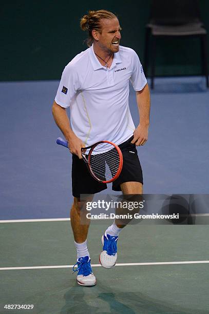 Peter Gojowzyk of Germany reacts during his match against Jo-Wilfried Tsonga of France during day 1 of the Davis Cup Quarter Final match between...