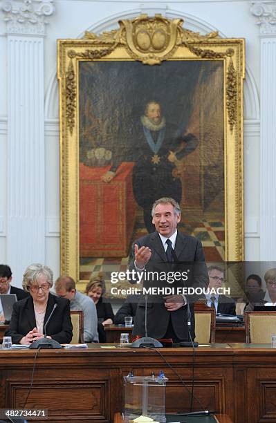 President of the French centrist Democratic Movement , and newly elected mayor of Pau, Francois Bayrou , standing in front of a portrait of French...