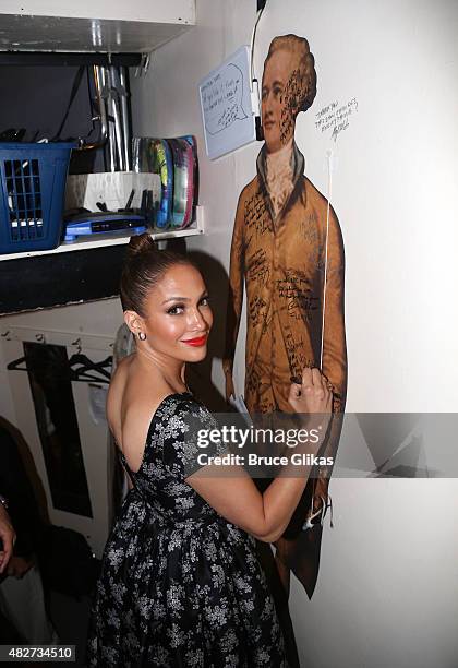 Jennifer Lopez signs the wall backstage at the hit new musical "Hamilton" on Broadway at The Richard Rogers Theater on August 1, 2015 in New York...