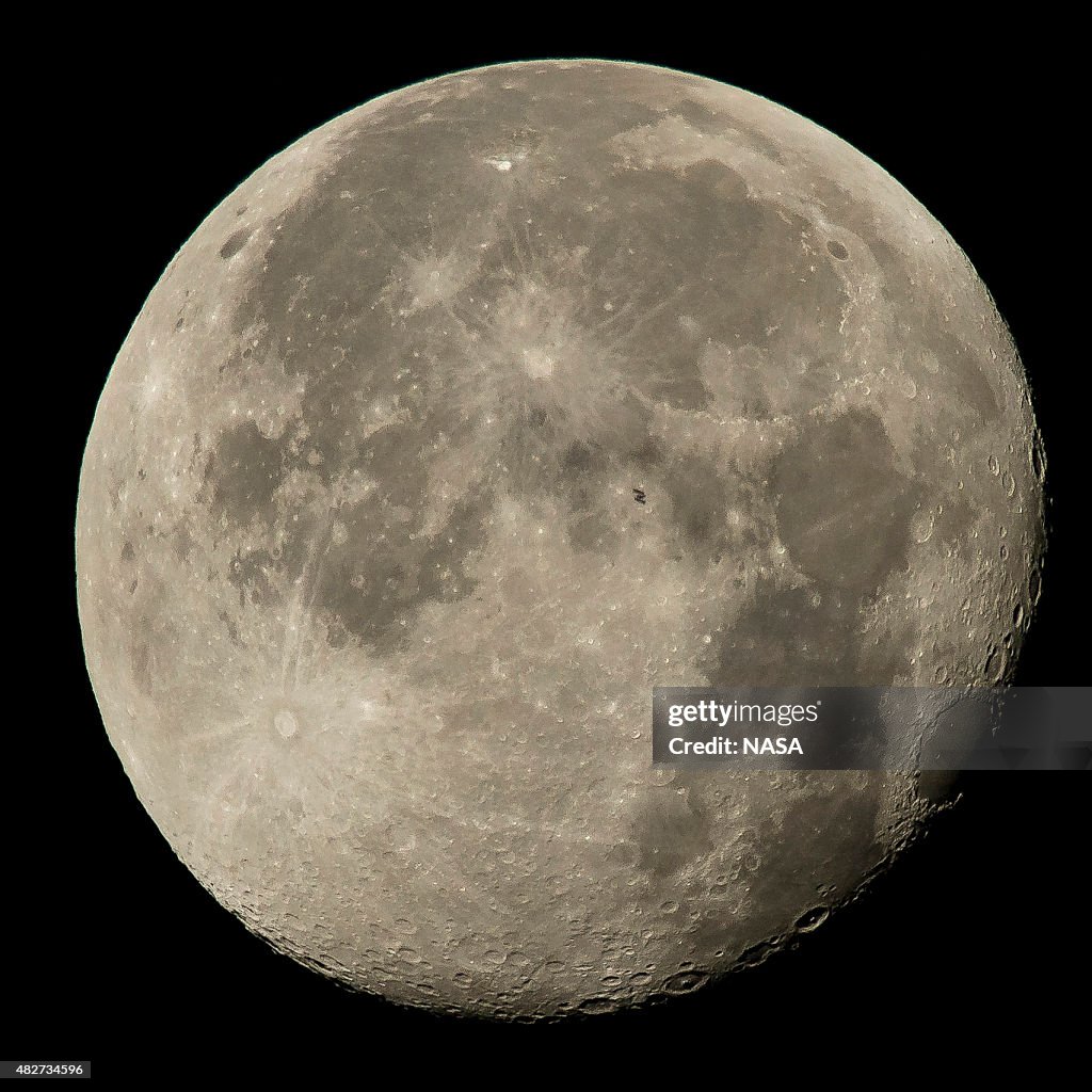 International Space Station Flies Above The Full Moon