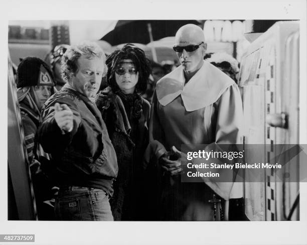 Director Ridley Scott, with supporting actors in costume, on the set of movie 'Blade Runner', 1982.