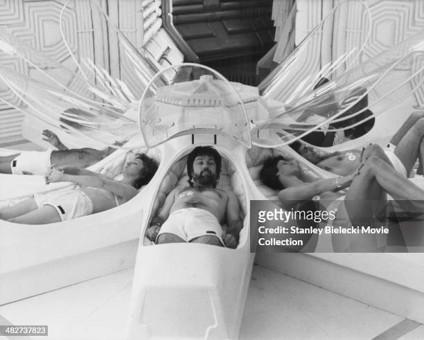 Actors Veronica Cartwright, Tom Skerritt, Sigourney Weaver and John Hurt, part of the crew of the Nostromo, awakening from stasis in a scene from the...