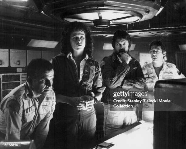 Actors Ian Holm, Sigourney Weaver, Tom Skerritt and John Hurt, in a scene from the movie 'Alien', 1979.