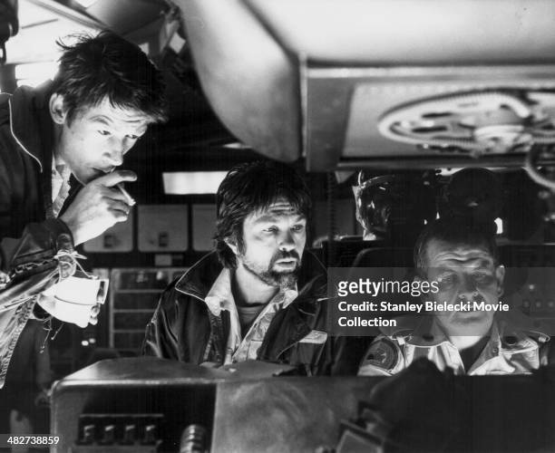 Actors John Hurt, Tom Skerritt and Veronica Cartwright in a scene from the movie 'Alien', 1979.