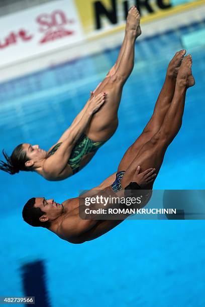 Brazil's divers Ian Matos and Juliana Veloso compete in the Mixed 3m Synchronised Springboard final diving event at the 2015 FINA World Championships...