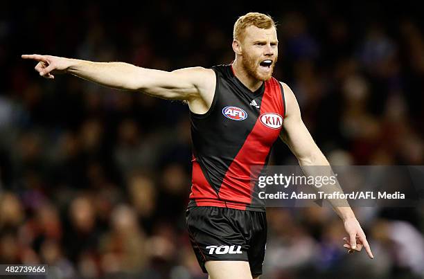 Adam Cooney of the Bombers speaks to teammates during the 2015 AFL round 18 match between the Essendon Bombers and the Western Bulldogs at Etihad...