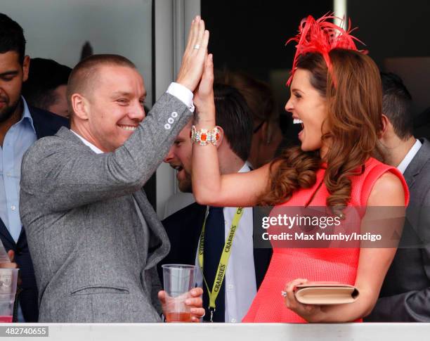 Jamie O'Hara and Danielle O'Hara watch the racing as they attend day 2, Ladies Day, of the Crabbie's Grand National horse racing meet at Aintree...