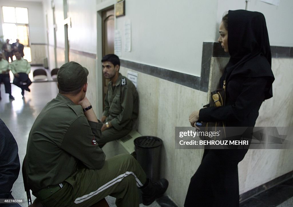 The sister of Iranian dissident Hashem Aghajari, Somayeh , waits to