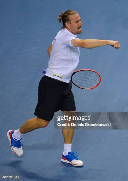 Peter Gojowzyk of Germany celebrates after winning his match against Jo-Wilfried Tsonga of France during day 1 of the Davis Cup Quarter Final match...