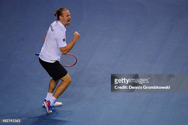 Peter Gojowzyk of Germany celebrates after winning his match against Jo-Wilfried Tsonga of France during day 1 of the Davis Cup Quarter Final match...
