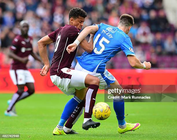 Osman Sow of Hearts is tackled by Brad McKay of St Johnstone during the Ladbrokes Scottish Premiership match between Heart of Midlothian FC and St...