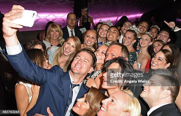 Actor Channing Tatum, his wife actress Jenna Dewan-Tatum and singer Paula Abdul take 'selfies' with guests at the 5th Annual Celebration of Dance...