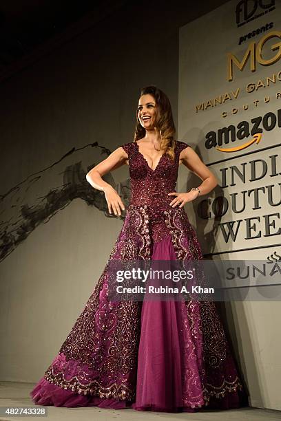 Bollywood actress Kangna Ranaut models designer Manav Gangwani's couture line on the fifth and final day of the Fashion Design Council of India's...