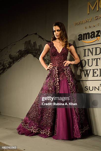 Bollywood actress Kangna Ranaut models designer Manav Gangwani's couture line on the fifth and final day of the Fashion Design Council of India's...