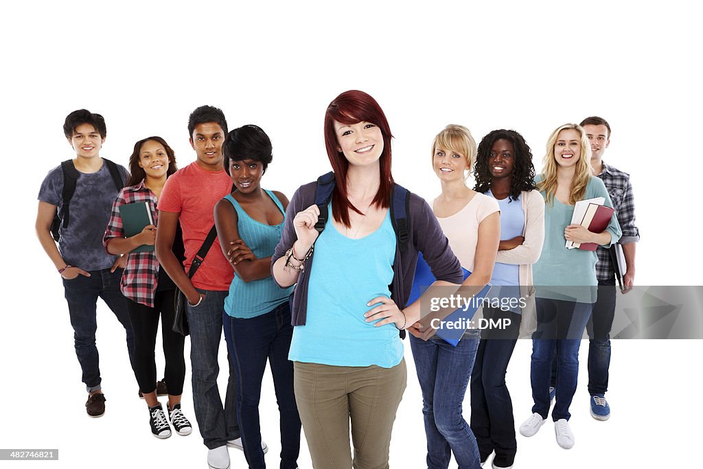 Beautiful young student with her group standing on white