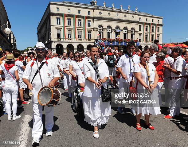 Marching band with Basque txistu flute players performs during the 79th Bayonne festival in Bayonne, southwestern France, on Ausgust 2, 2015. AFP...