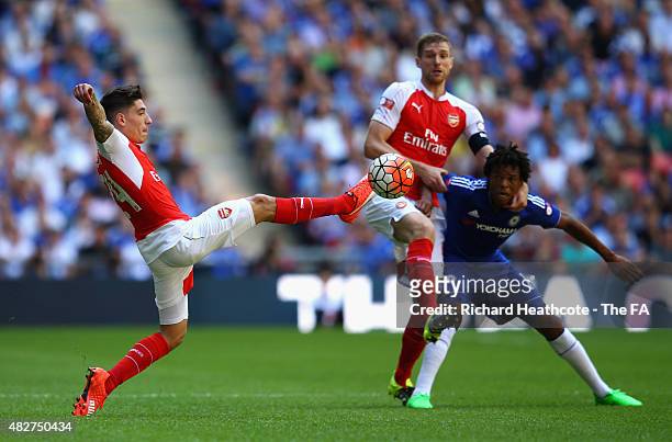 Hector Bellerin of Arsenal stretches for the ball as Per Mertesacker of Arsenal battles with Loic Remy of Chelsea during the FA Community Shield...