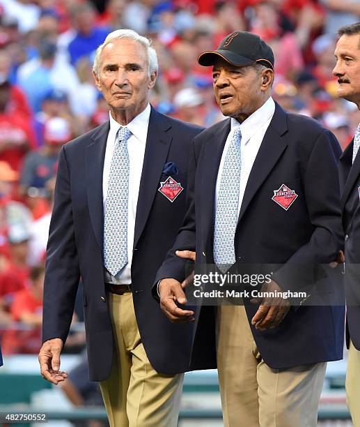 Baseball Hall of Famers Sandy Koufax and Willie Mays stand together on the field prior to the 86th MLB All-Star Game at Great American Ball Park on...