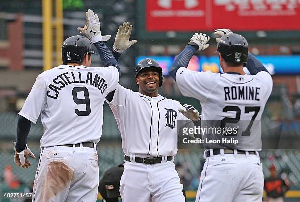 Rajai Davis of the Detroit Tigers celebrates after hitting a three run home run in the fourth inning scoring Nick Castellanos and Andrew Romine...