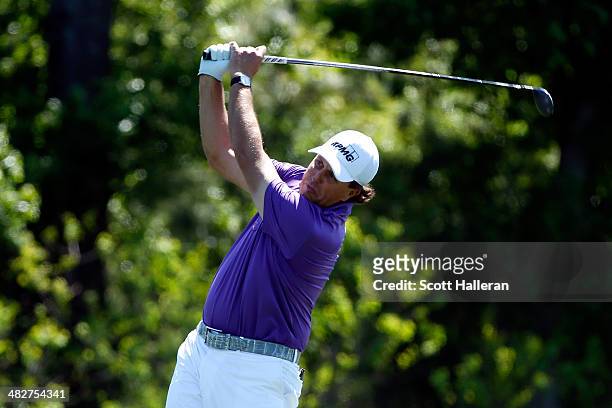 Phil Mickelson of the United States plays a shot from the fairway on the eighth hole during round two of the Shell Houston Open at the Golf Club of...