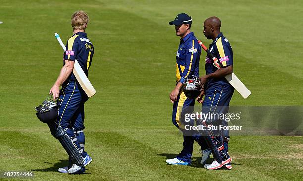 Hampshire batsmen Michael Carberry and Jimmy Adams chat to Glamorgan captain Jacques Rudolph as they leave the pitch after both Hampshire openers...